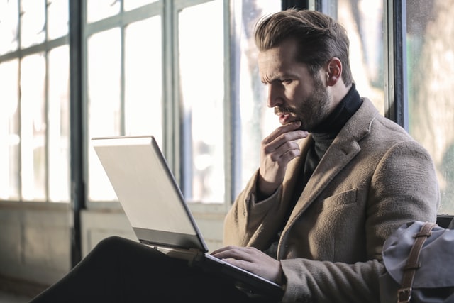 image of man working on a laptop computer