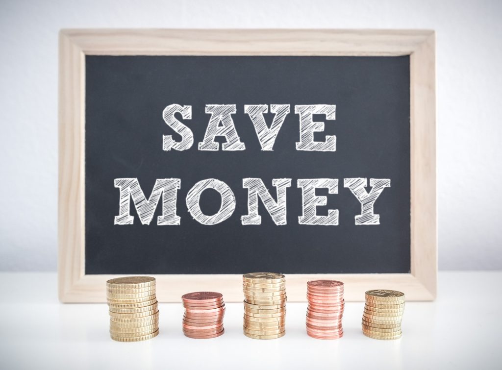 image showing stack of coins with save money sign above