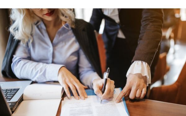 image of business woman signing a contract