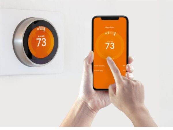 image of a smart thermostat with phone control